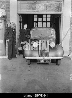 The famous cinema organist , Mr Robinson Cleaver , with Mr Lewis Evans posing next to a Vauxhall car . 10 February 1939 Stock Photo
