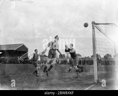 Chislehurst Old Boys vs. Lloyds reserves - Kent Junior Cup A county final - Chislehurst Old Boys White heads over his own bar with goalkeeper Butler out of position. Played at Aylesford - 29/03/37 Goal mouth action . 1937 Stock Photo