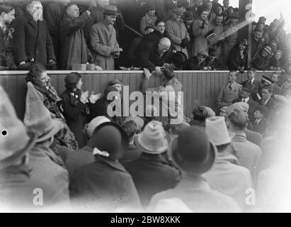 Chislehurst Old Boys vs. Lloyds reserves - Kent Junior Cup A county final - Chislehurst Old Boys captain is congratulated by Mr H Miller manager of Lloyds Sittingbourne Paper Mills. - 29/03/37 O B receiving medals . 1937 Stock Photo