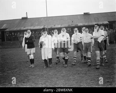 The Woolwich Metropolitan Police Football Club take part in a novelty football match . The team and their beards walk onto the pitch . 1939 Stock Photo