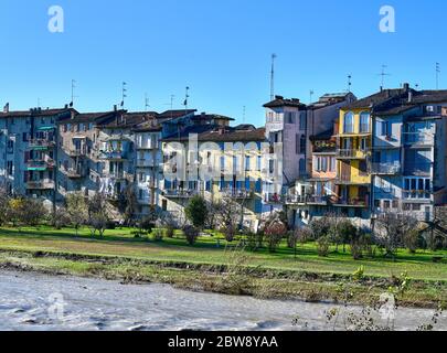 View of the picturesque coloured houses on the river Parma from Ponte di Mezzo, in Parma, on a sunny winter day Stock Photo