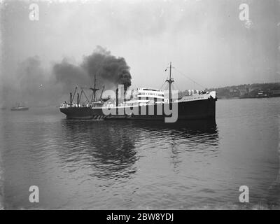 The SS ' Pacific Shipper ' passes Gravesend with a list to port and a Lockheed Hudson on her decks. 24 April 1939 Stock Photo