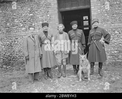 Horse trick riding in Eynsford , Kent . Jean Celieres , Captain Korolkoff , Miss Peddar , Jorganoff and Lieutenant Poliakoff pose for a group photo with a dog . 1939 Stock Photo