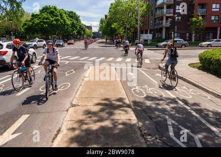 Montreal, CA - 30 May 2020: Cycling corridor on Rachel Street in the Rosemont – La Petite-Patrie borough during Corovanirus Covid-19 pandemic Stock Photo