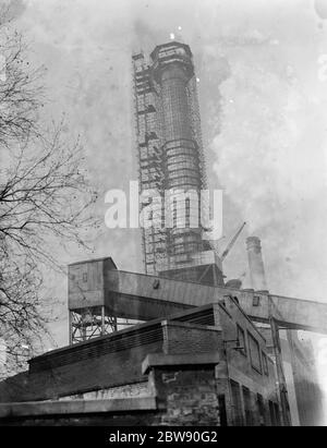 Work being done on a chimney of the Deptford Power Station in London . 1937 Stock Photo