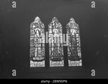 Stain glass windows at the Holy Trinity church in Eltham , London . The three saints depicted are left to right : Saint Clare , Saint Louis and Saint Barbara . 4 February 1939 Stock Photo