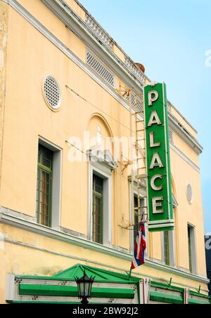 Palace theatre in downtown Hilo, Hawaii is now an arthouse.  This building has a green marque and light tan stucco exterior and was built in 1925. Stock Photo