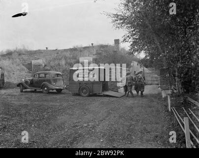 An emergency underground hospital in Erith , London . Using an auxilliary ARP ambulance to bring in the ' wounded ' during a training drill . 1939 Stock Photo