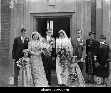 The wedding of Miss E M Irons and Mr H T Rabbit . The wedding group . 1939 Stock Photo