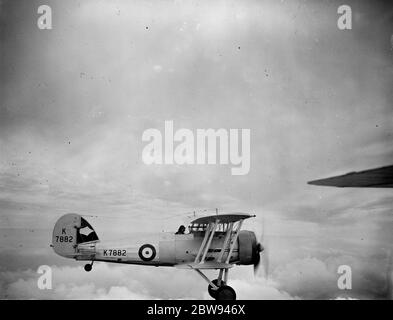 Gloster Gauntlets in flight over Biggin Hill , London , for the Empire Air Day practice . 1938 Stock Photo