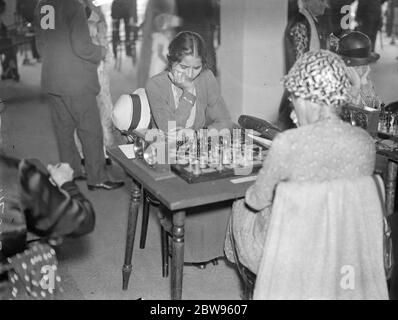 Lost in her game . Chess champions from every part of the world are  competing in the second annual Chess Congress which has opened at the Grand  Hotel , Margate . One