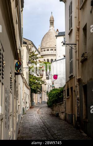 Paris, France - May 12, 2020: Typical street in Montmartre in Paris at the end of the day during lockdown due to covid-19 Stock Photo