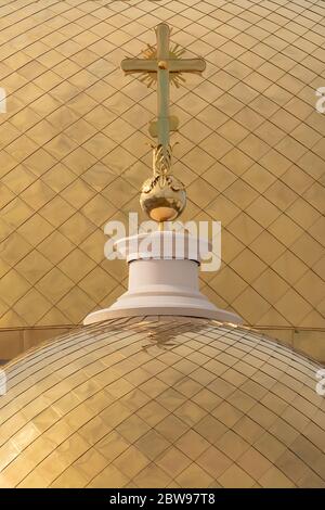 close up view of golden domes of the Russian Orthodox Church with a golden cross Stock Photo
