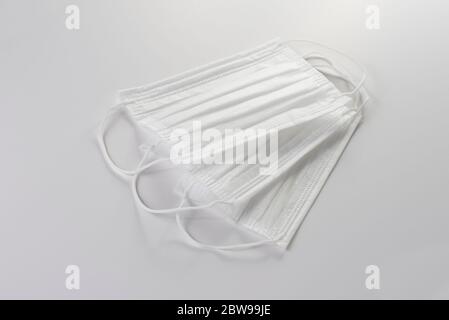 Three face masks on a white background. Stock Photo