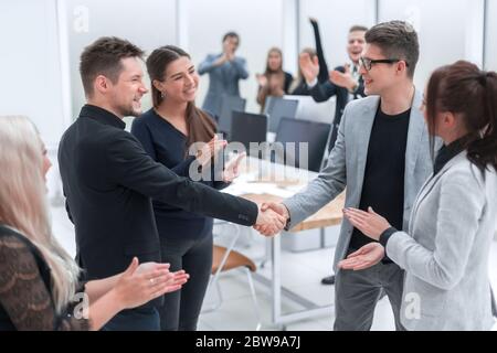 happy business partners confirming the transaction with a handshake Stock Photo