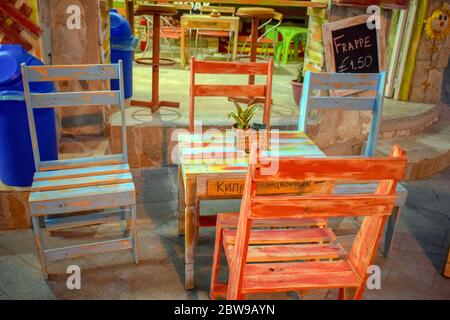 Beautiful colorful wood  chair and table in the middle оn restaurant Stock Photo