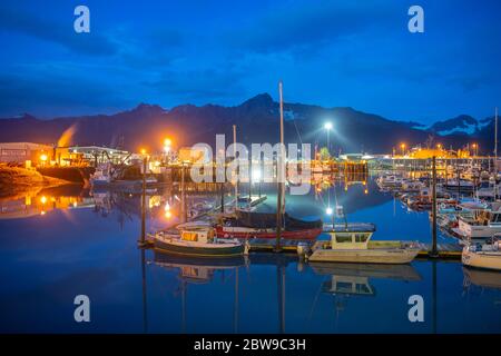 Seward Boat Harbor and waterfront at night, Seward, Kenai Peninsula, Alaska, AK, USA. Stock Photo