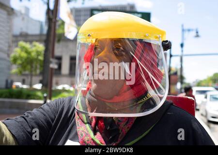 Newark, New Jersey, USA. 30th May, 2020. A woman is shown wearing a face shield during a mayoral press conference addressing the protests and injustice ravaging our communities at City Hall in Newark, New Jersey. Credit: Brian Branch Price/ZUMA Wire/Alamy Live News Stock Photo