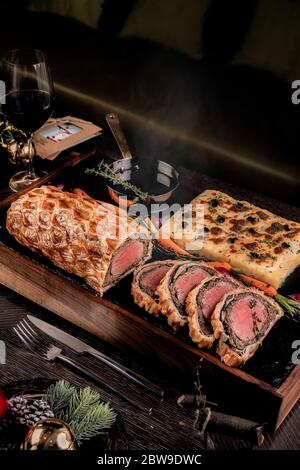 Homemade Christmas Beef Wellington with a Pastry Crust. Stock Photo
