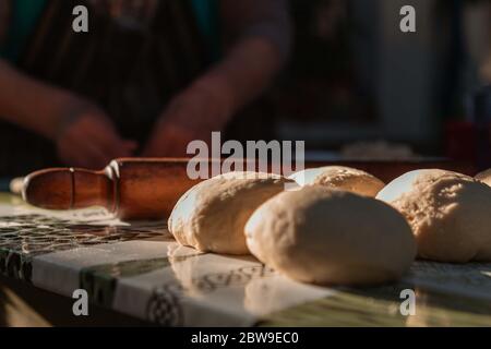 lady kneading on the table Stock Photo