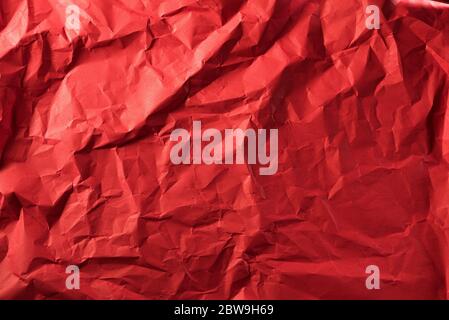 Texture of crumpled red paper. Creative vintage for design background. Stock Photo