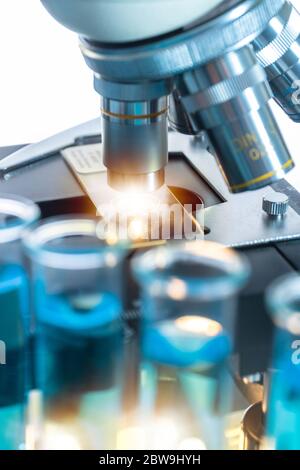 Close-up of test tubes and microscope Stock Photo