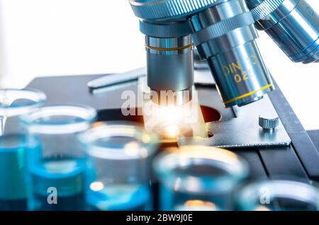 Close-upÂ of test tubes and microscope Stock Photo