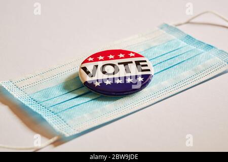 Vote pin on surgical mask Stock Photo