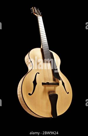 Classical guitar against black Stock Photo