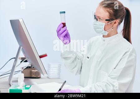 Female technician working in laboratory Stock Photo