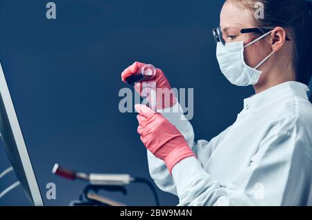 Female technician working in laboratory Stock Photo