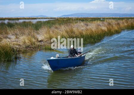 A boatman heading to Uros Island Stock Photo