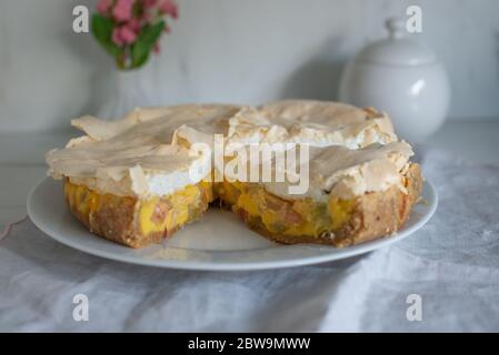 Home made rhubarb meringue cake on a plate Stock Photo