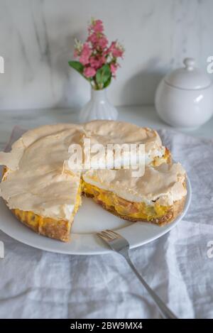Home made rhubarb meringue cake on a plate Stock Photo