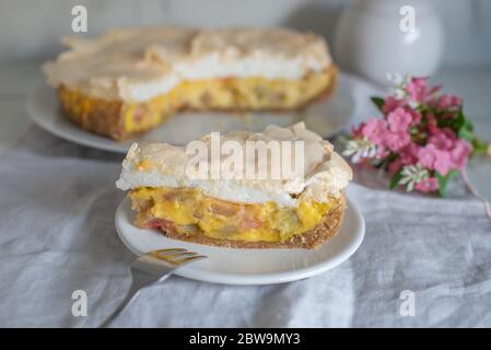 Home made rhubarb meringue cake on a plate Stock Photo