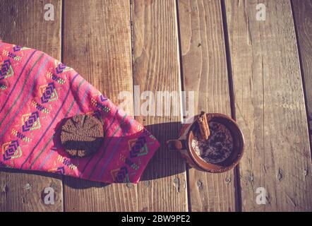 champurrado or mexican chocolate with cinnamon in traditional clay cup Stock Photo