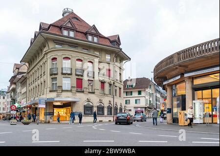 Interlaken, Switzerland - October 2019: Old European buildings located in downtown Interlaken, a famous resort town destination in Switzerland Stock Photo