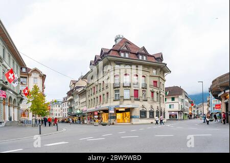 Interlaken, Switzerland - October 2019: Old European buildings located in downtown Interlaken, a famous resort town destination in Switzerland Stock Photo