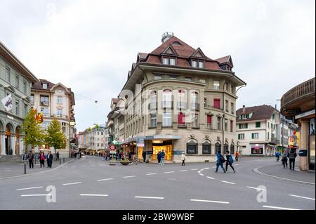 Interlaken, Switzerland - October 2019: Old European buildings located in downtown Interlaken, a famous resort town destination in Switzerland Stock Photo