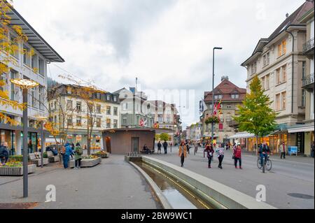 Interlaken, Switzerland - October 2019: Old European buildings located in downtown Interlaken, a famous resort town destination in Switzerland Stock Photo