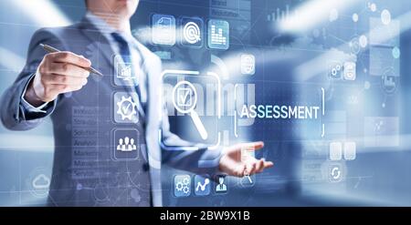 Assessment evaluation business finance concept. Businessman pressing on virtual screen Stock Photo