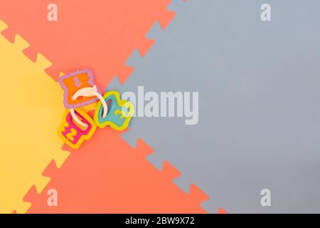 Foam flooring tiles, mats inside a play room, kindergarten school or gym. Potential use as a colorful background with copy space. Stock Photo