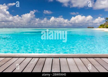 Empty wooden planks with blur beach on background, can be used for product placement. Summer landscape, abstract beach and copy space Stock Photo