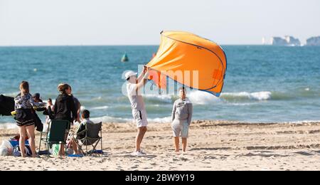 Poole, UK. 31st May 2020.    The Early birds  setting up for the day at Sandbanks beach, Poole, Dorset Credit: Richard Crease/Alamy Live News Stock Photo