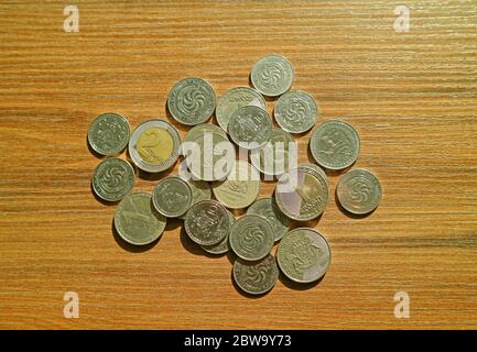 Top View of Heap of Georgian Lari and Tetri Coins on Wooden Background Stock Photo