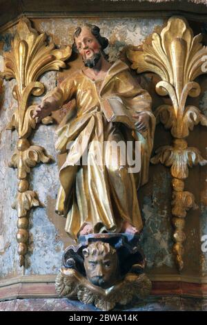 St. Mark the Evangelist statue at the pulpit in the Church of the Assumption of the Virgin Mary in Taborsko, Croatia Stock Photo