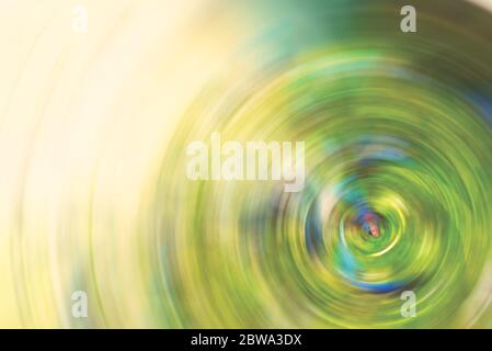 Abstract Background of green tone spin circle radial motion blur. Stock Photo