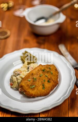 Czech chicken schnitzel or steak with potato salad. Czech traditional christmas day dinner Stock Photo