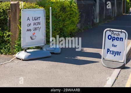 Poole, Dorset UK. 31st May 2020. A light of hope and unity - porch open for prayer signs outside St Aldhelm's Church, Branksome, Poole during Coronavirus Covid 19 pandemic lockdown. Credit: Carolyn Jenkins/Alamy Live News Stock Photo