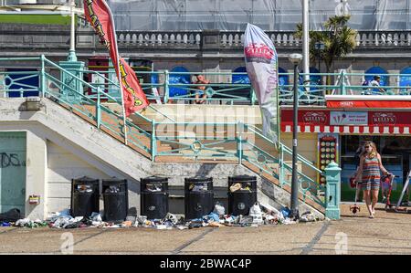 Brighton UK 31st May 2020 - Litter and bottles left behind overnight from Saturday along Brighton beach and seafront on another beautiful sunny day during the Coronavirus COVID-19 pandemic crisis  . Credit: Simon Dack / Alamy Live News Stock Photo